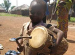 Child with a talking drum